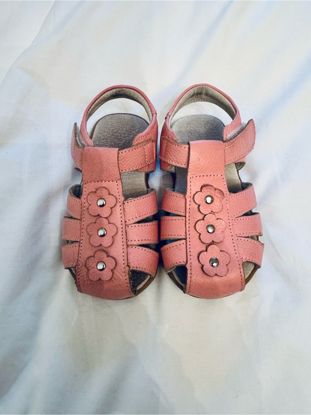 Pink leather dress sandals with flowers. Hook and loop closure. Size 9.